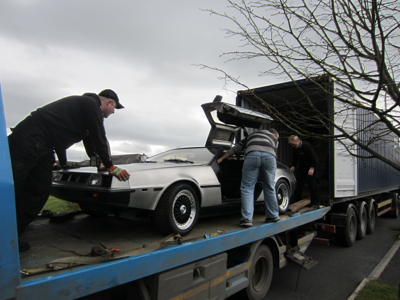 Loading the car on the trailer to move to America. For the body of the car—which came from Massachusetts—this was somewhat of a homecoming!